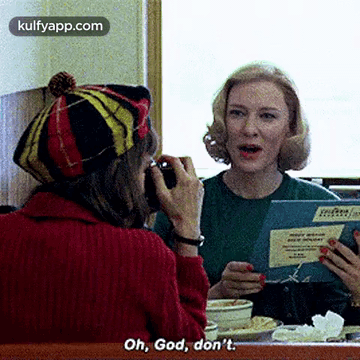 Woman In Red Sweater Talking On Cell Phone GIF