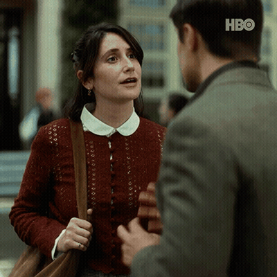 Woman In Red Sweater Talking To Man In HBO Suit GIF