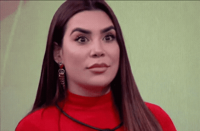 Woman In Red Sweater With G Earring GIF