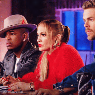 Woman In Red Sweater With Two Men In Hats GIF