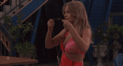 Woman In Red Swimsuit In Front Of CBS Sign GIF
