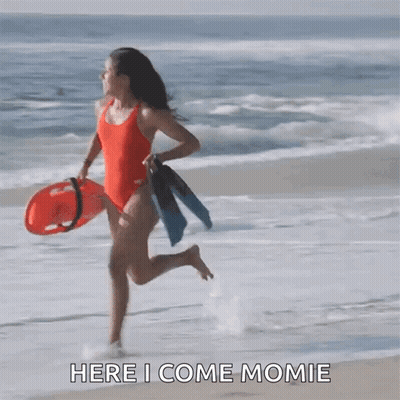 Woman In Red Swimsuit Runs With Life Preserver And Flippers GIF