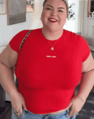 Woman In Red T-Shirt And Jeans Smiling GIF