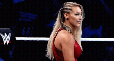 Woman In Red Tank Top Standing In Wrestling Ring GIF