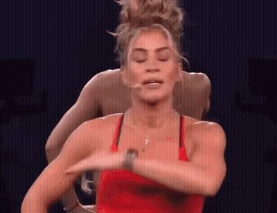 Woman In Red Tank Top With Cross Necklace Dancing GIF