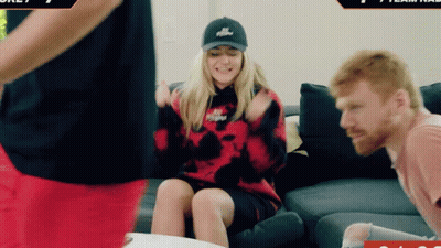 Woman In Red Tie-Dye Sitting Next To Man GIF