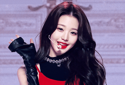 Woman In Red Top And Black Gloves Holding Microphone GIF
