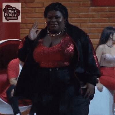 Woman In Red Top And Black Jacket Black Friday Sign GIF