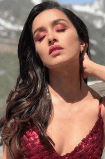 Woman In Red Top And Earrings GIF