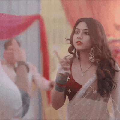 Woman In Red Top And White Saree Pointing GIF