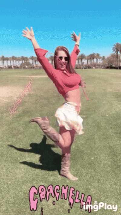 Woman In Red Top And White Skirt Arms Raised GIF