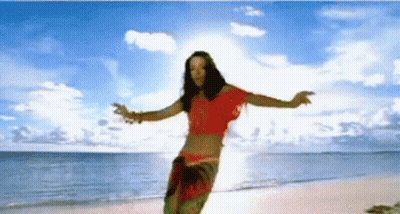Woman In Red Top Dancing Arms Outstretched Beach GIF
