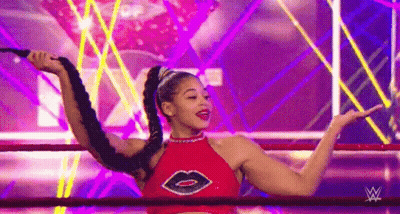 Woman In Red Top Holding Whip In Ring GIF