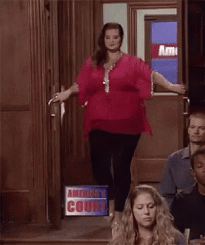 Woman In Red Top In Courtroom GIF