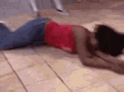 Woman In Red Top Laying On Floor GIF