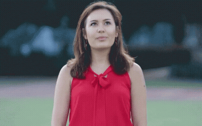 Woman In Red Top Looking Up GIF