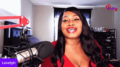 Woman In Red Top Smiling At Microphone Lovelyti GIF