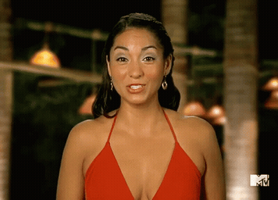 Woman In Red Top Standing In Front Of MTV Sign GIF