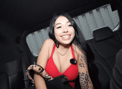 Woman In Red Top With Arm Tattoo Smiling GIF