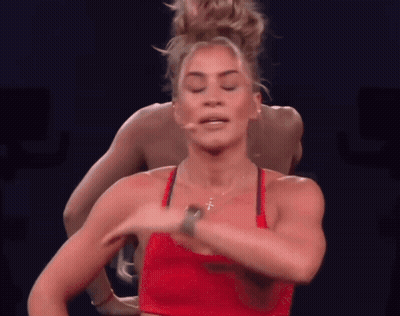 Woman In Red Top With Cross Necklace GIF