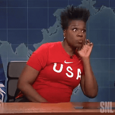 Woman In Red USA Shirt Sitting At Desk GIF
