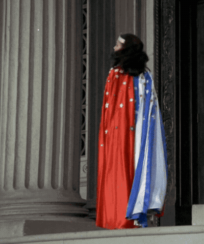 Woman In Red White And Blue Cape GIF