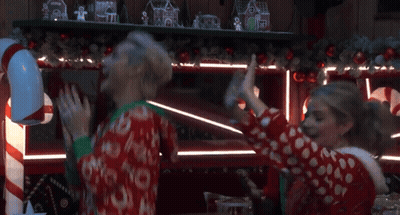 Woman In Red-White Polka Dot Sweater Arms Raised GIF