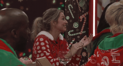Woman In Red-White Polka Dot Sweater With Wine GIF