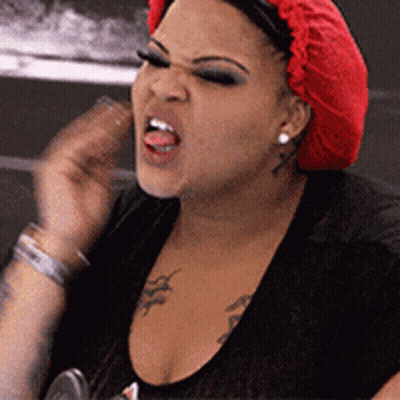 Woman In Red Wig Black Shirt Funny Face GIF