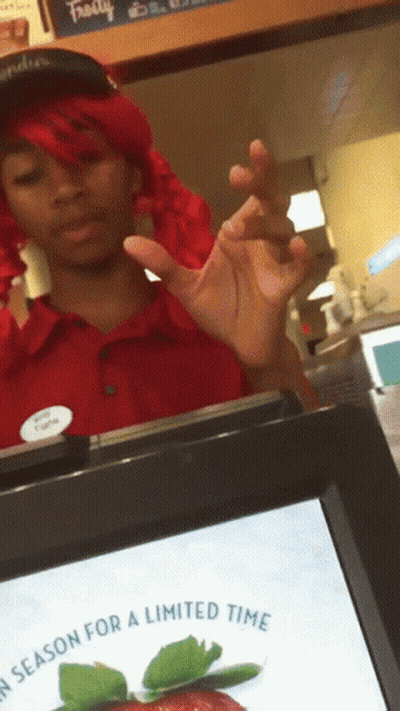 Woman In Red Wig Standing In Front Of Screen Saying Season For A Limited Time GIF