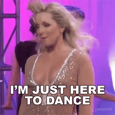 Woman In Revealing Dress Dancing Says I'm Just Here To Dance GIF