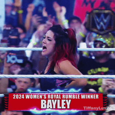 Woman In Ring With 2024 Women's Royal Rumble Winner Bayley Sign GIF