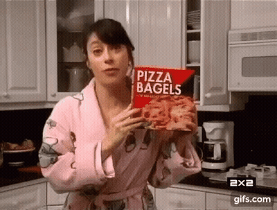 Woman In Robe Holding Pizza Bagels GIF