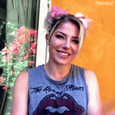 Woman In Rolling Stones T-Shirt Smiling GIF