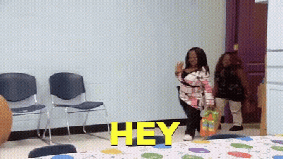 Woman In Room With Hey On Wall GIF