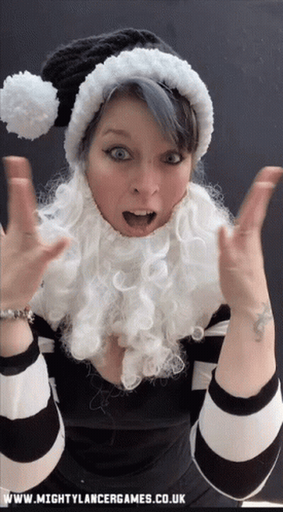 Woman In Santa Hat And Beard With Www.mightylancergames.co.uk GIF