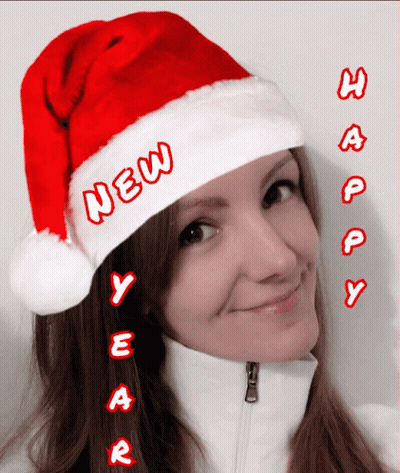 Woman In Santa Hat Says New Year GIF