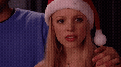 Woman In Santa Hat Says Stop Trying To Make Immunity Debt Happen GIF