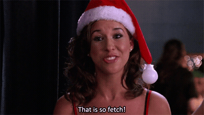 Woman In Santa Hat Smiling Says That Is So Fetch GIF