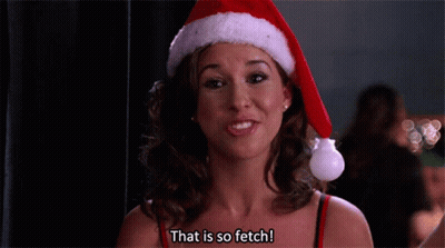 Woman In Santa Hat Smiling Says That Is So Fetch GIF