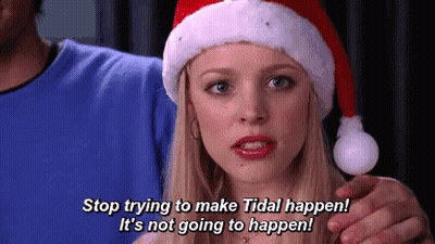 Woman In Santa Hat Talking To Man GIF