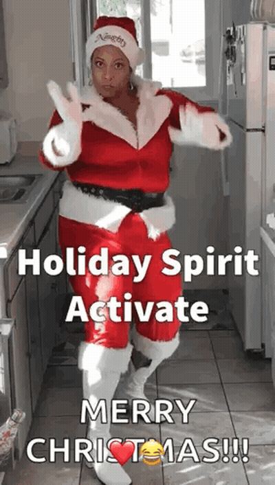 Woman In Santa Suit Dancing In Kitchen Holiday Spirit Activate Merry Christmas GIF