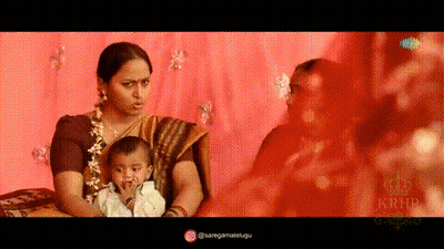 Woman In Sari Holding Baby GIF