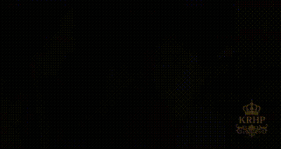 Woman In Sari With Crown In Front Of Chandelier GIF