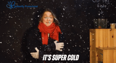 Woman In Scarf And Gloves Saying It's Super Cold GIF