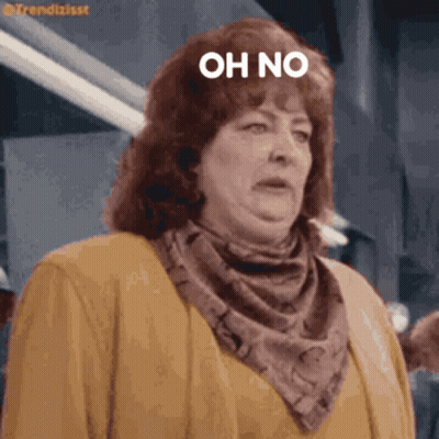Woman In Scarf And Jacket Saying Oh No GIF