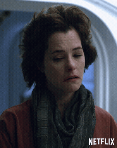 Woman In Scarf And Red Shirt With Netflix GIF