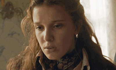 Woman In Scarf And Sweater Close Up GIF