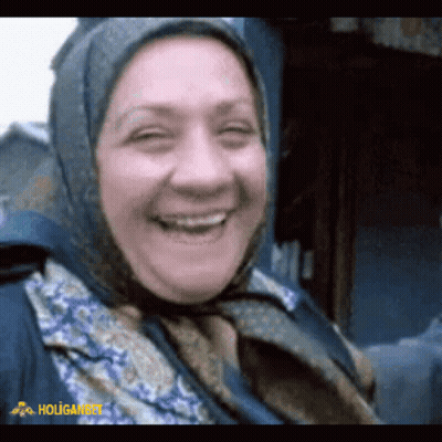 Woman In Scarf Smiling Holigan GIF