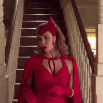 Woman In Scarlet Witch Costume On Stairs GIF